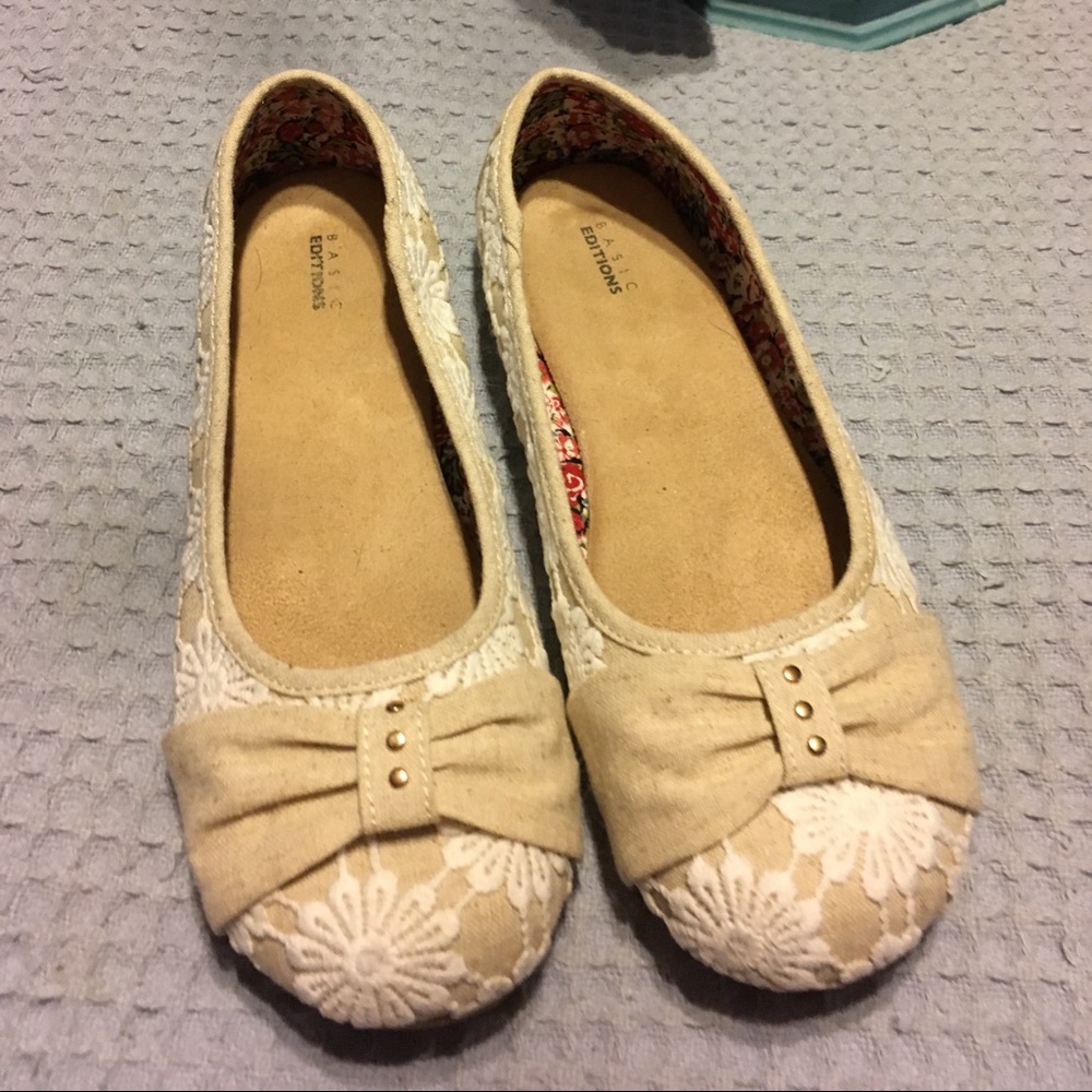Kaki flats with white flower overlay.